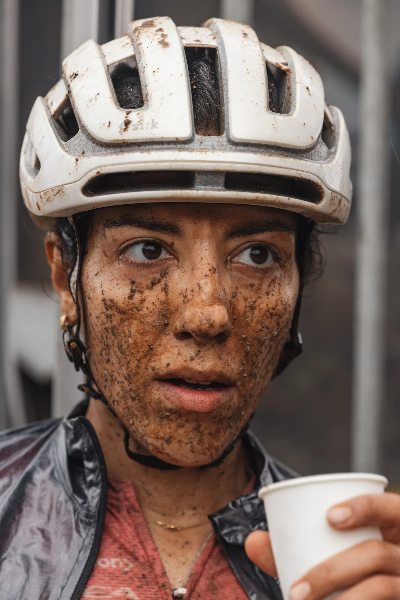 A close portrait, mud-covered face
