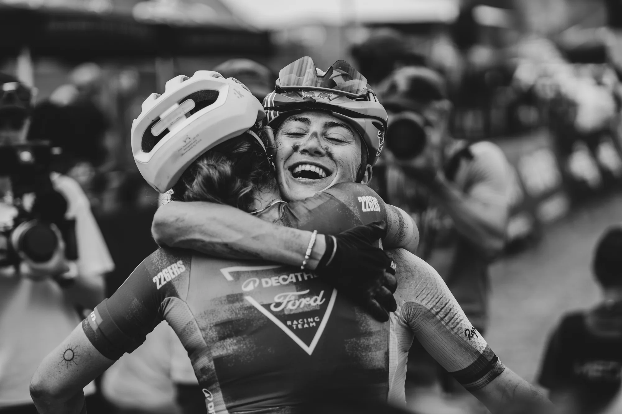 Two riders embracing, black and white