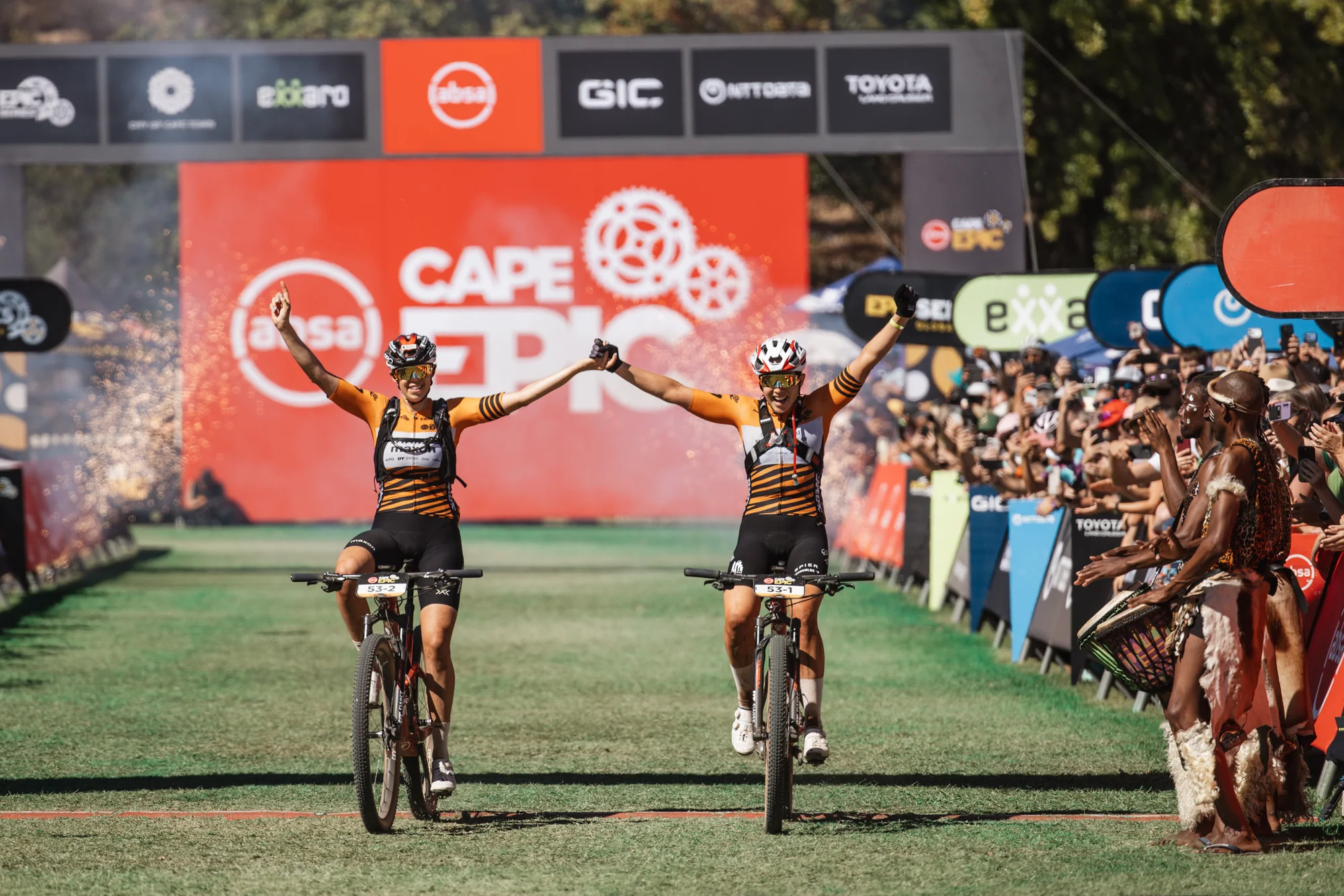 Riders finishing under the Cape Epic arch