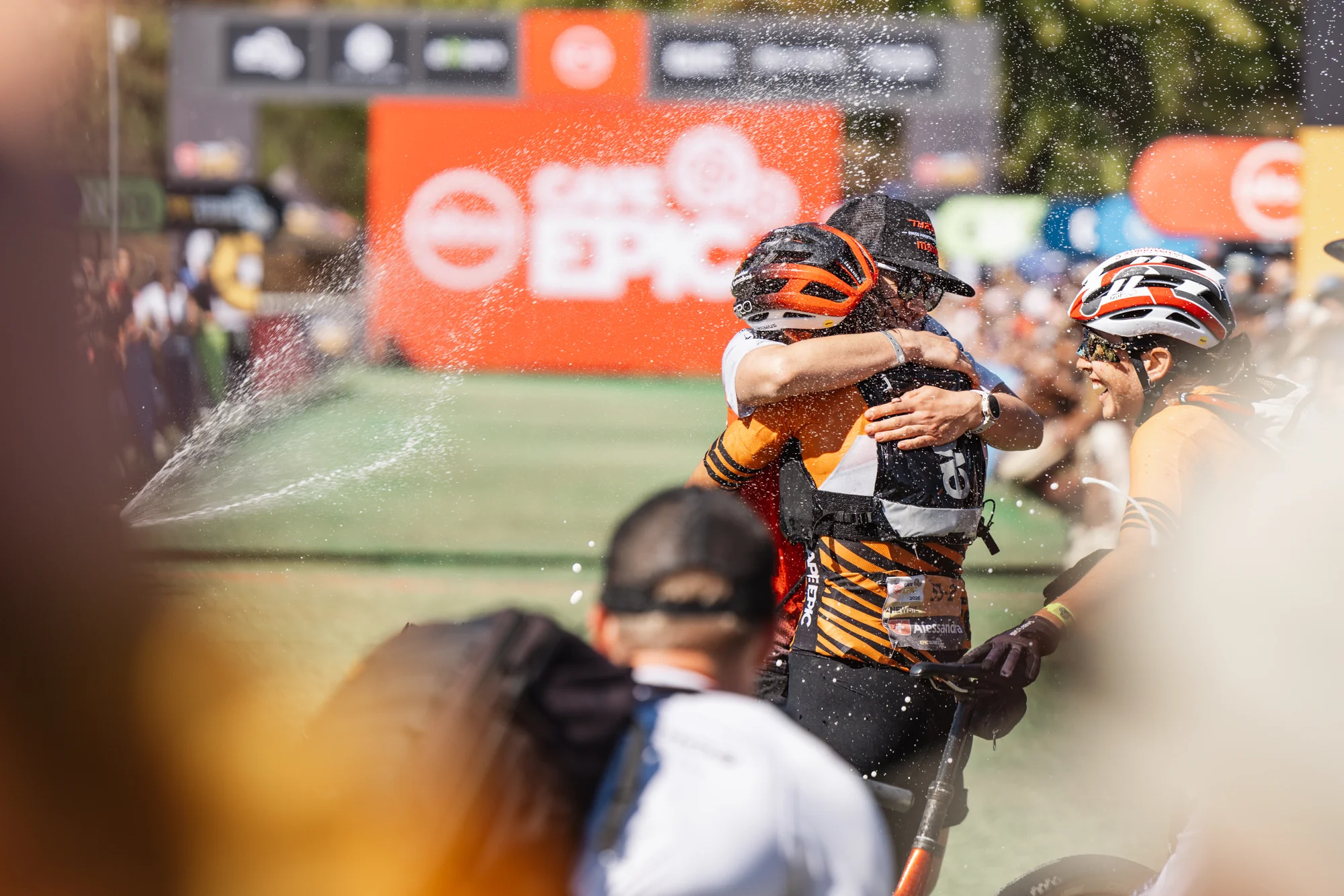A group embrace at the finish, closing