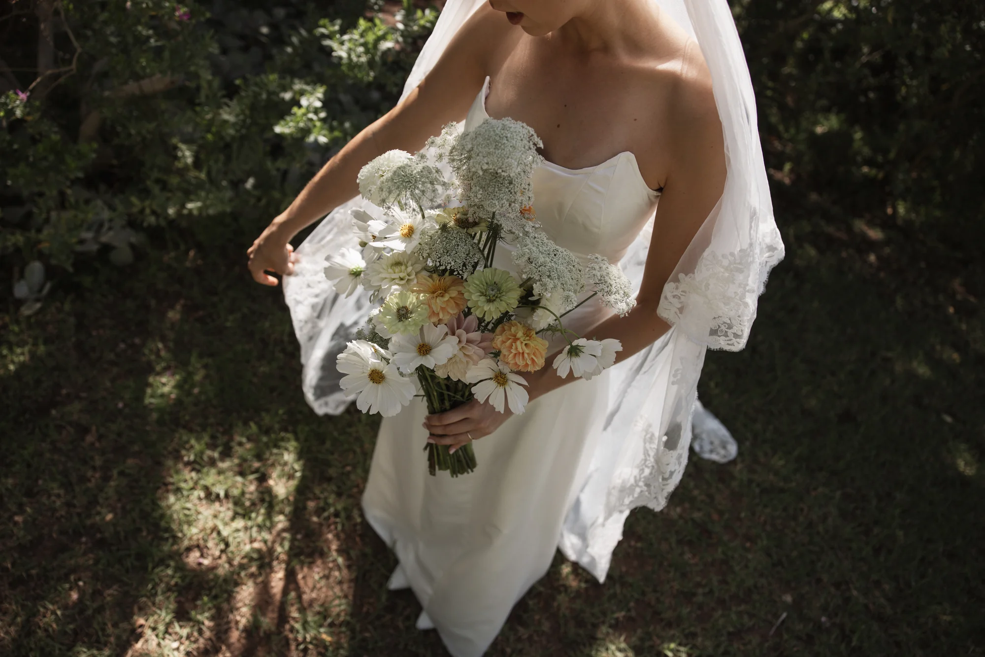 The bouquet, held close