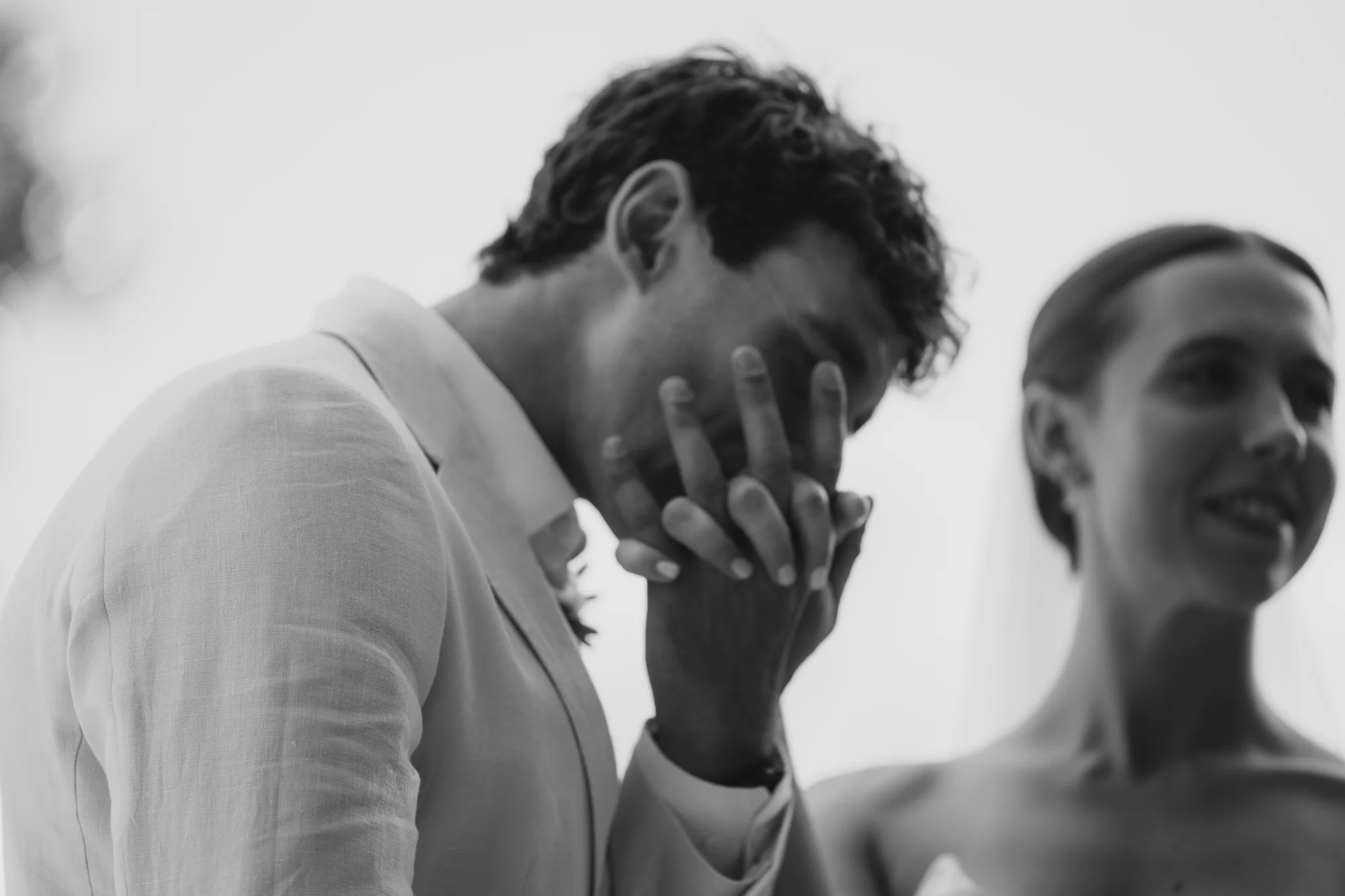 The groom overcome with emotion, black and white